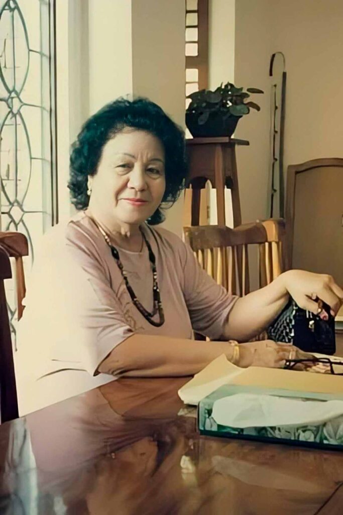 Edith L. Tiempo seated at a table in her home in Negros Oriental