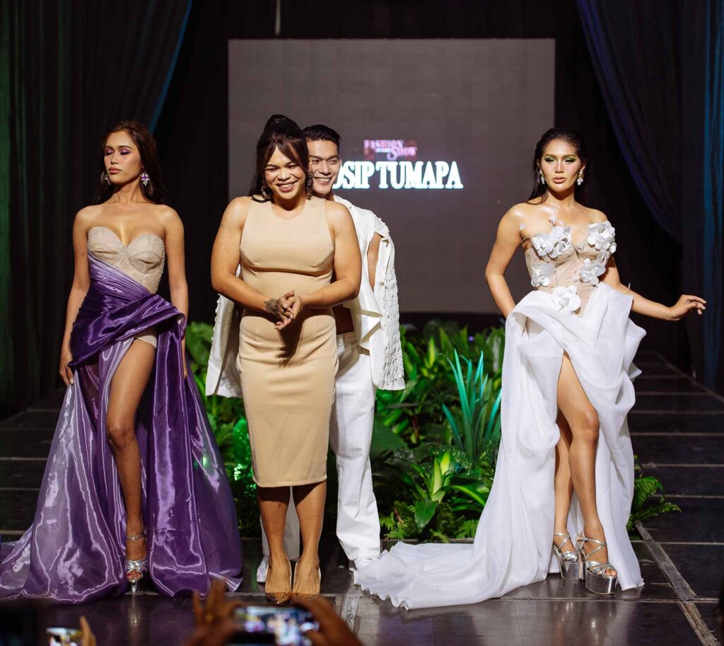 Josip Tumapa on the runway with models presenting designs from the Flow and Motion collection