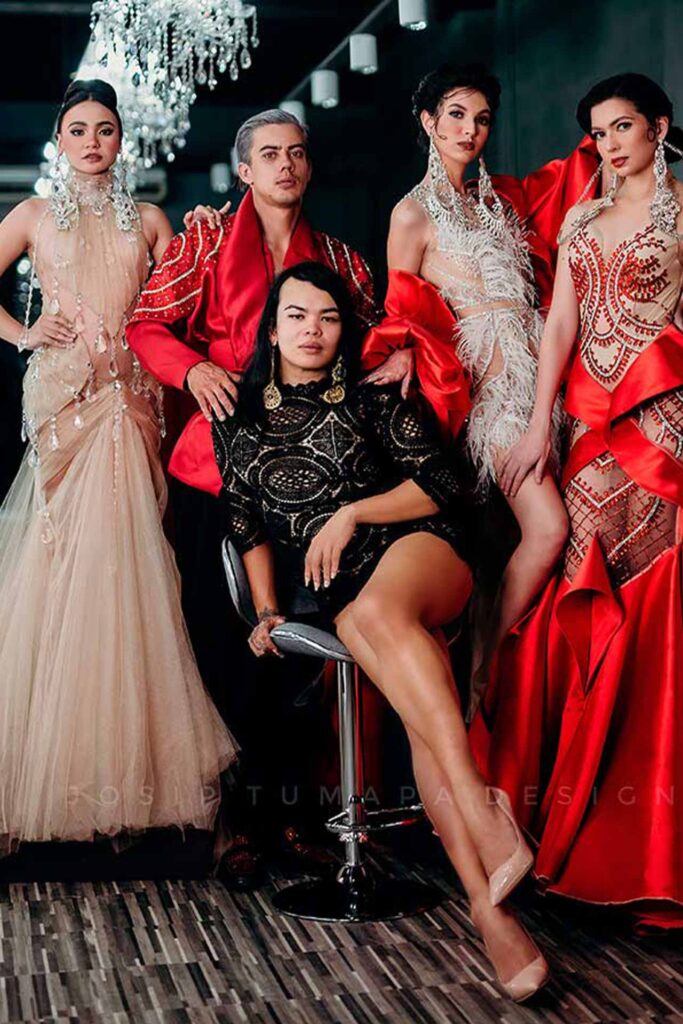 Josip Tumapa with models wearing designs from the Also a Dreamer eveningwear collection