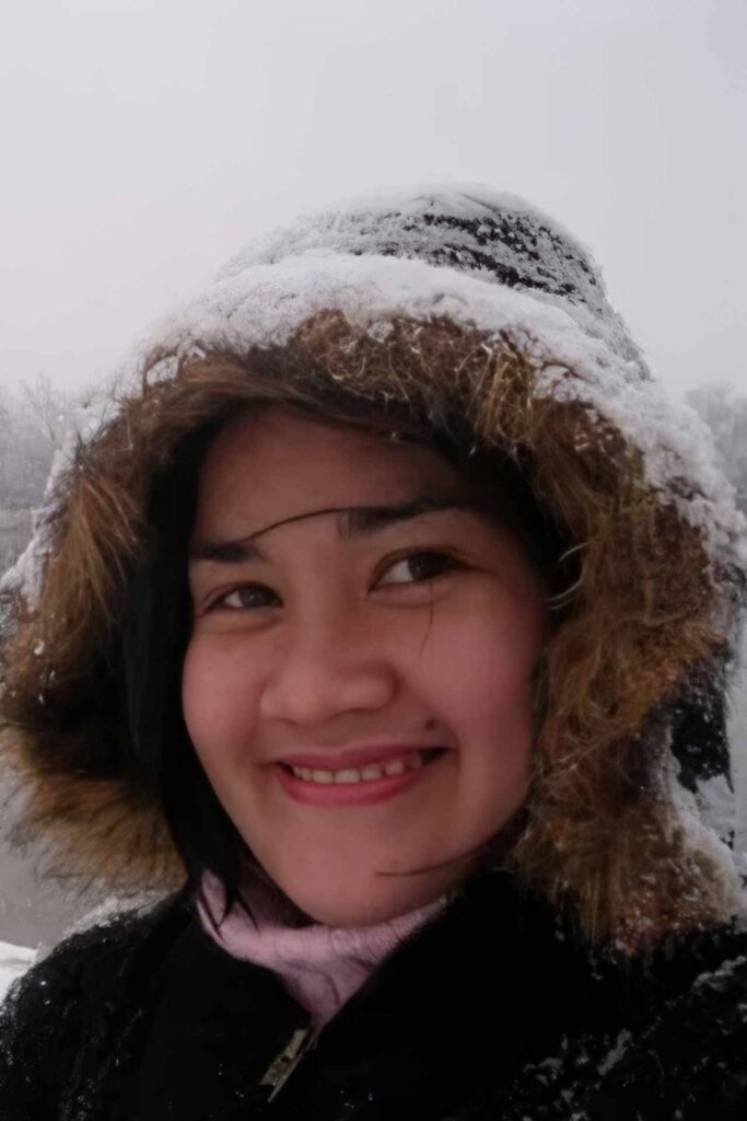 Portrait of Filipino writer Lakambini “Bing” Sitoy in a snowy outdoor setting