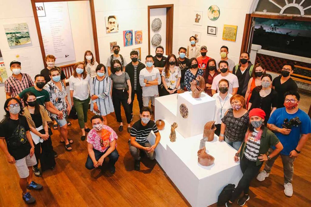 Evgeniya Spiridonova among artists and members of the local creative community at the Atoa art exhibition during the COVID-19 pandemic