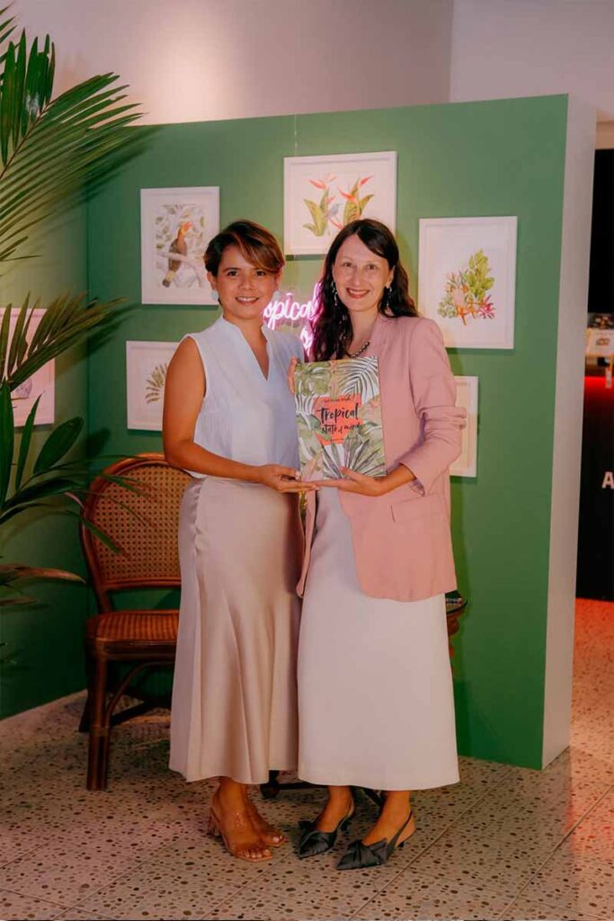 Evgeniya Spiridonova (right) with Filipino artist Gretchen Villanueva-Heras at her solo art exhibition and art book launch, Tropical State of Mind