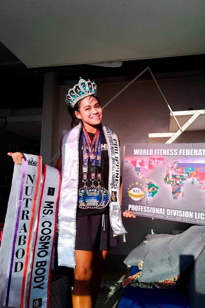 Julianna Nicole Lopez wearing a crown, medals, and WFF Philippines Sports Model Overall Champion 2023