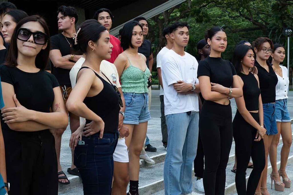 Models and participants gathering before a fashion show rehearsal in Dumaguete