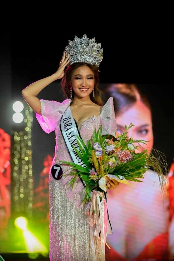 Yzza Enriquez wearing her crown and holding flowers after winning Miss Negros Oriental 2025