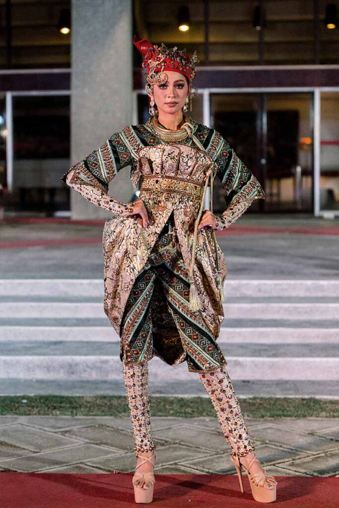 Erica Jean Cadayday modeling an embellished couture look from Amir Sali’s collection