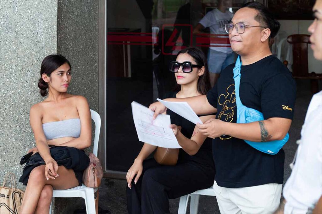 Models receiving instructions during a fashion show rehearsal