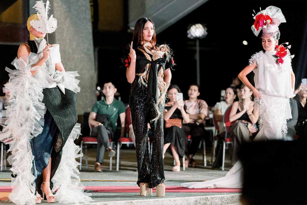 Three models presenting runway looks from Tingting Delfin’s fashion collection